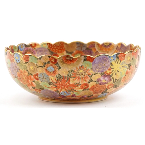 A Japanese Satsuma earthenware bowl with intricate hand painted gilded floral pattern having a scall... 