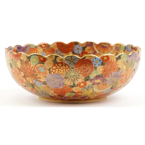  A Japanese Satsuma earthenware bowl with intricate hand painted gilded floral pattern having a scall... 