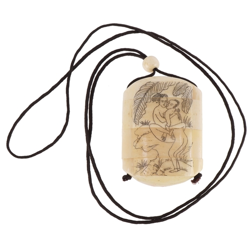 154 - A Japanese bone four section inro carved with an erotic couple and a dragon, 6cm high.