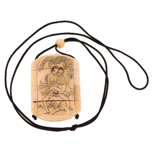 158 - A Japanese bone four section inro carved with an erotic couple and a bird, 6cm high.