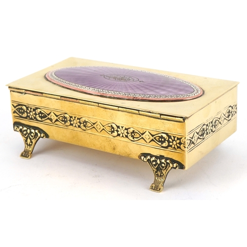  An early 20th century Lenk Austria brass and copper footed jewellery box, the hinged lid mounted wit... 