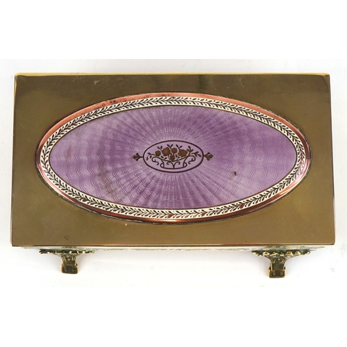  An early 20th century Lenk Austria brass and copper footed jewellery box, the hinged lid mounted wit... 