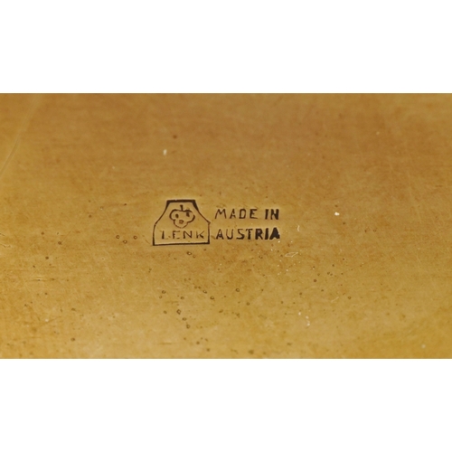  An early 20th century Lenk Austria brass and copper footed jewellery box, the hinged lid mounted wit... 