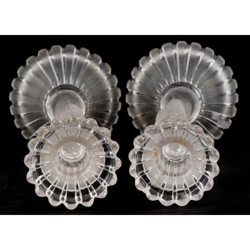 163 - Baccarat, a pair of frosted glass cherub candlesticks, 25cm high.