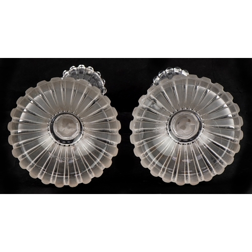 163 - Baccarat, a pair of frosted glass cherub candlesticks, 25cm high.