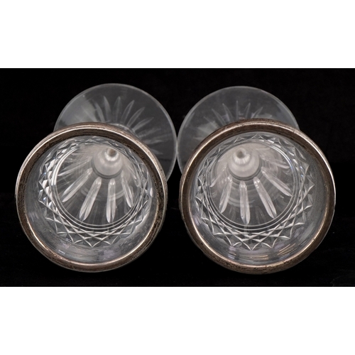 3674 - Army & Navy, a pair of Edwardian cut glass spill vases with silver mounts, London 1911, 15cm high.