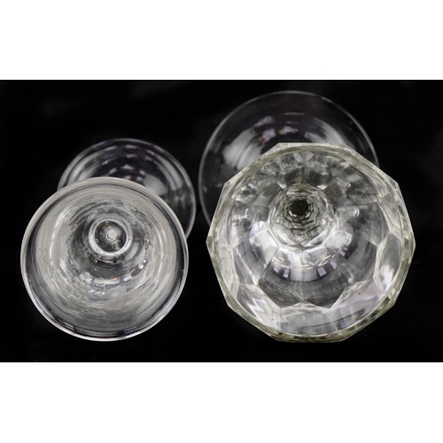 42 - An 18th century wine glass with air twist stem and etched floral decoration together with a facetted... 