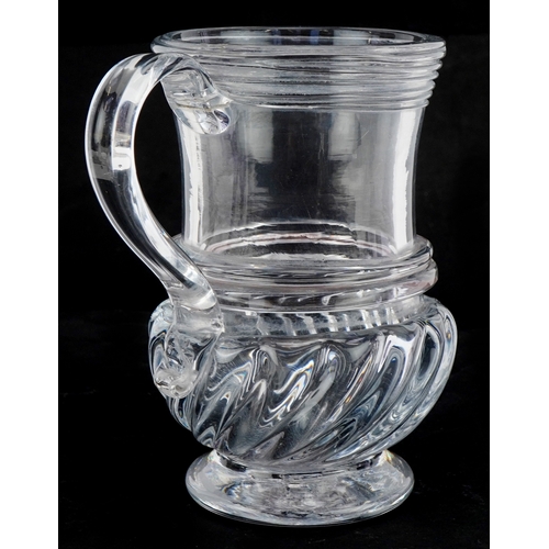 45 - A Georgian hand blown glass tankard, 14.5cm high.