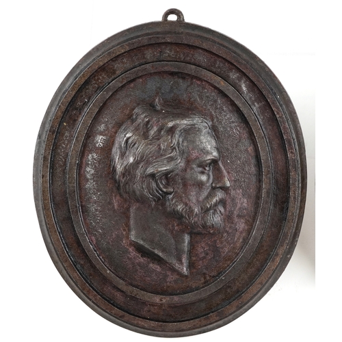 528 - Joseph Kudlicz, a pair of late 19th/early 20th century cast iron plaques of The Founders of Soilol, ... 