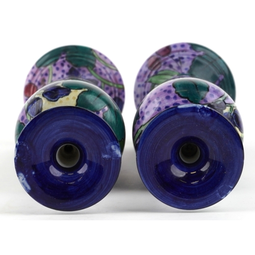 330 - A matched pair of Thomas Forrester & Sons Phoenix Ware baluster vases, each decorated with fruit, th... 
