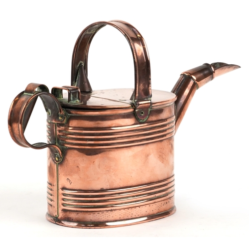 525 - An early 20th century copper watering can, 20cm high.