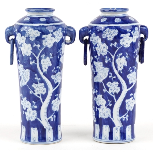 1462 - A matched pair of Chinese blue and white porcelain vases with ring handles and hand painted floral d... 