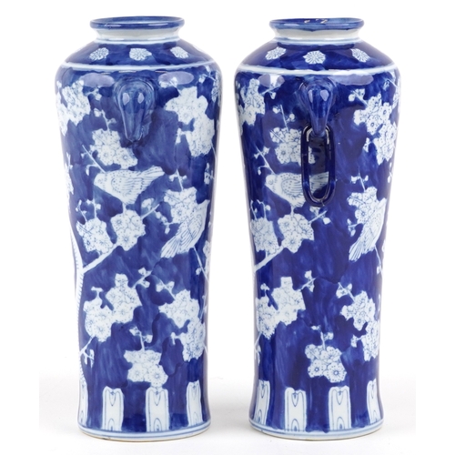 1462 - A matched pair of Chinese blue and white porcelain vases with ring handles and hand painted floral d... 