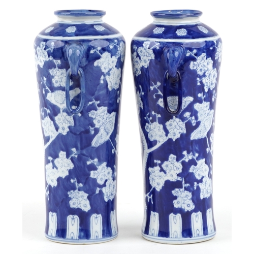 1462 - A matched pair of Chinese blue and white porcelain vases with ring handles and hand painted floral d... 