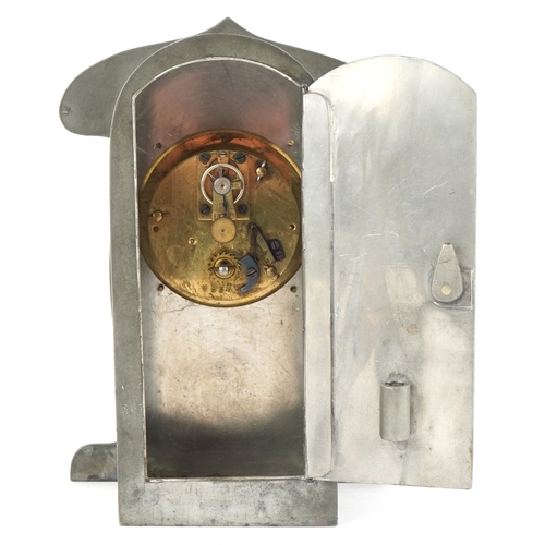  Archibald Knox for Liberty & Co., an Art Nouveau pewter tudric clock with copper dial and enamelled ... 
