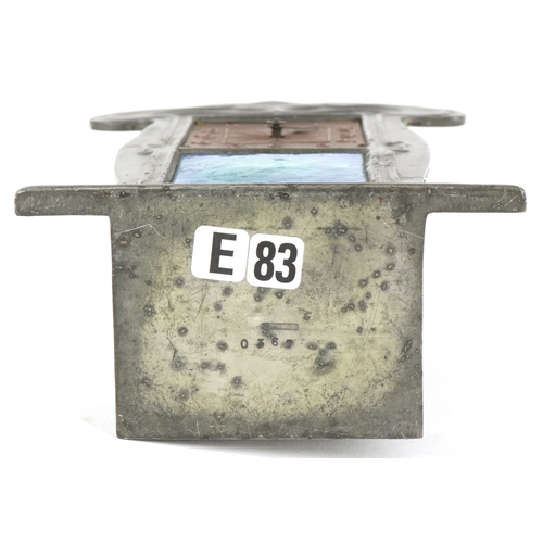  Archibald Knox for Liberty & Co., an Art Nouveau pewter tudric clock with copper dial and enamelled ... 