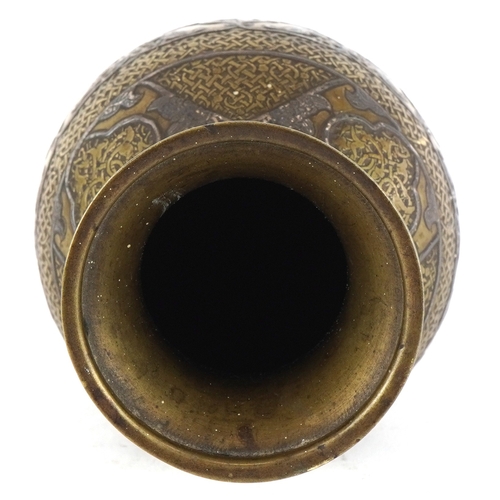 1534 - A Middle Eastern brass baluster vase with silver and copper inlay, profusely engraved with scrolling... 