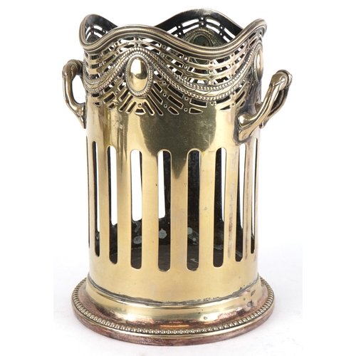 1532 - A 20th century silver plated twin handled wine bottle holder with pierced frieze, 20cm high.