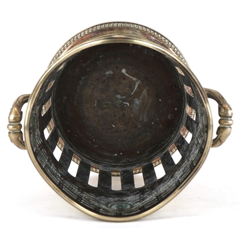 1532 - A 20th century silver plated twin handled wine bottle holder with pierced frieze, 20cm high.