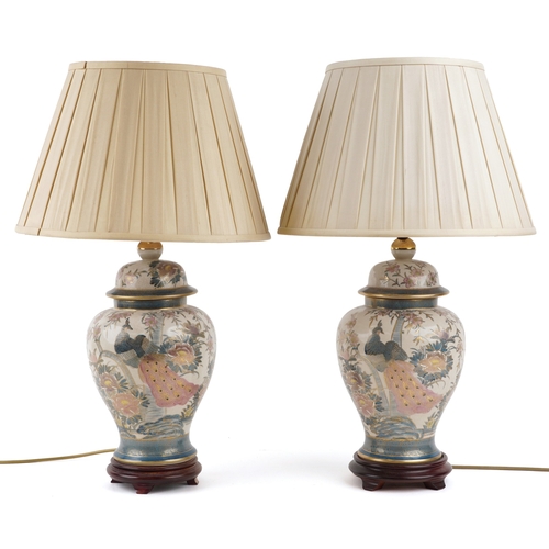 1537 - A pair of Chinese porcelain baluster vase table lamps hand painted with birds of paradise amongst fl... 