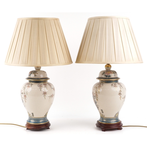 1537 - A pair of Chinese porcelain baluster vase table lamps hand painted with birds of paradise amongst fl... 