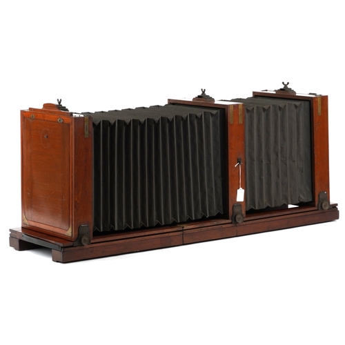  A large 19th century brass bound mahogany double bellow plate field camera, 112cm in length.