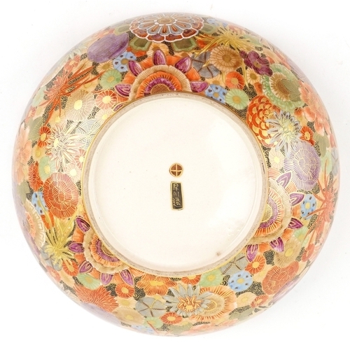  A Japanese Satsuma earthenware bowl with intricate hand painted gilded floral pattern having a scall... 