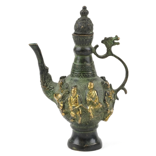 456 - A Chinese patinated brass wine jug with animalia handle, cast in high relief with elders, character ... 