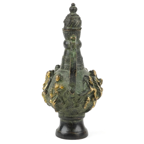 456 - A Chinese patinated brass wine jug with animalia handle, cast in high relief with elders, character ... 