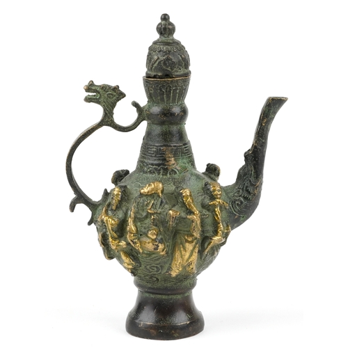 456 - A Chinese patinated brass wine jug with animalia handle, cast in high relief with elders, character ... 
