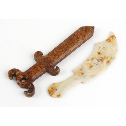 468 - A Chinese carved white and russet stone dagger together with a similar example, the largest 18cm in ... 
