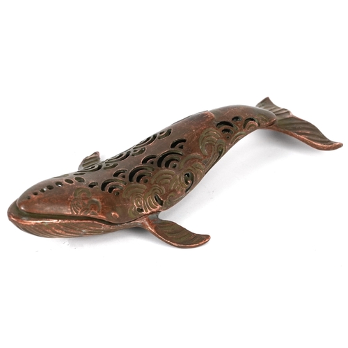510 - A Japanese patinated bronze censer in the form of a whale, character marks to the base, 16cm in leng... 