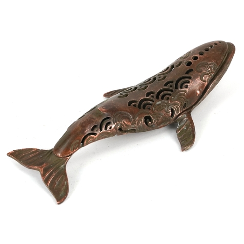510 - A Japanese patinated bronze censer in the form of a whale, character marks to the base, 16cm in leng... 