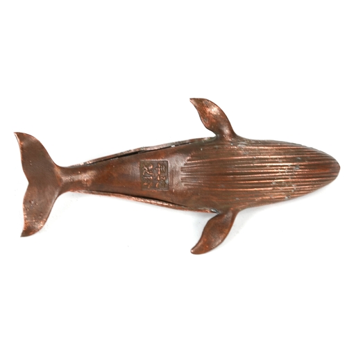 510 - A Japanese patinated bronze censer in the form of a whale, character marks to the base, 16cm in leng... 