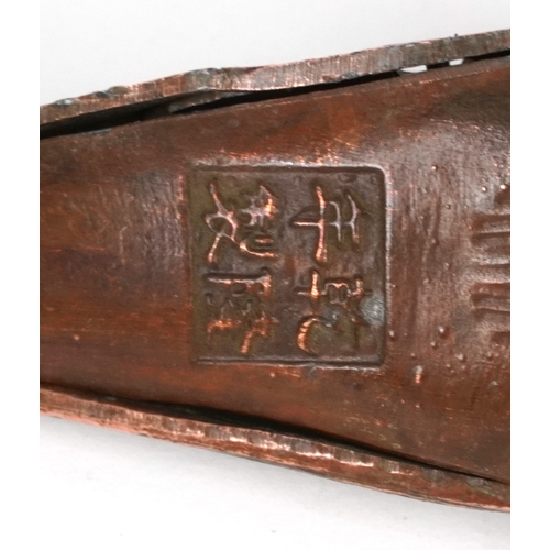 510 - A Japanese patinated bronze censer in the form of a whale, character marks to the base, 16cm in leng... 