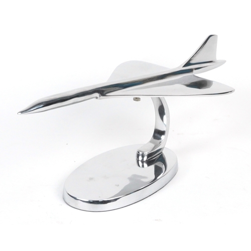 1577 - A chromed metal model of Concorde, 42cm in length.