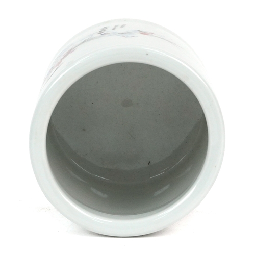 1694 - A Chinese porcelain brush pot decorated with birds in trees, 12cm high.