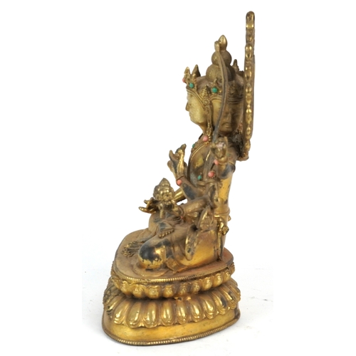 151 - A Chino Tibetan patinated bronze figure of a seated Buddha with pink and green coloured birds, 22cm ... 