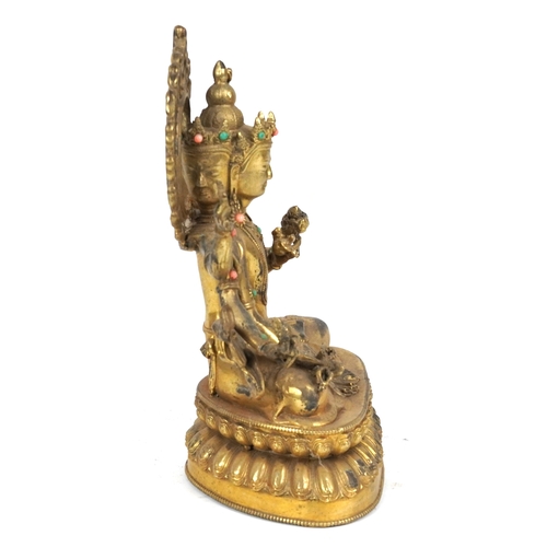 151 - A Chino Tibetan patinated bronze figure of a seated Buddha with pink and green coloured birds, 22cm ... 