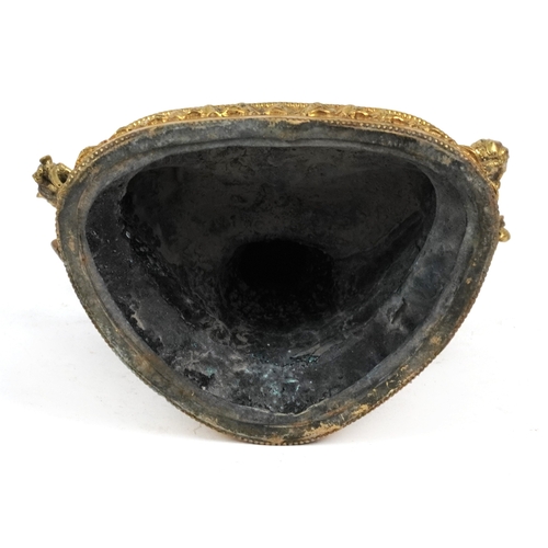 151 - A Chino Tibetan patinated bronze figure of a seated Buddha with pink and green coloured birds, 22cm ... 