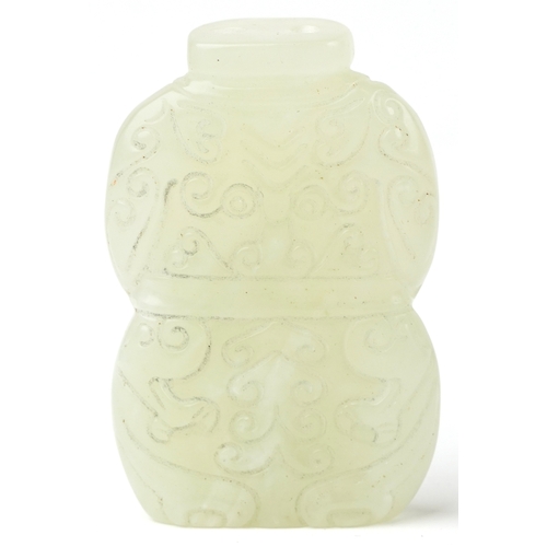 508 - A Chinese green stone carving of a kneeling figure, 6cm high, 58.7g.