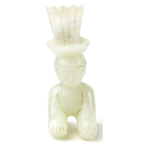 149 - A Chinese green stone carving of a seated figure, 7cm high.
