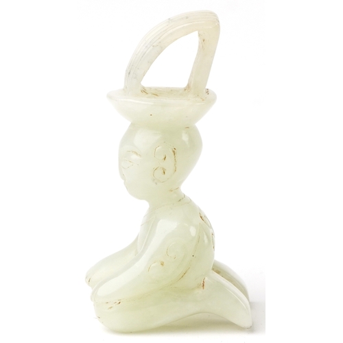 149 - A Chinese green stone carving of a seated figure, 7cm high.