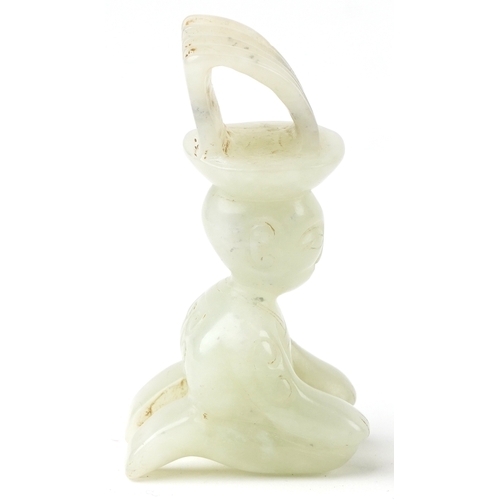 149 - A Chinese green stone carving of a seated figure, 7cm high.
