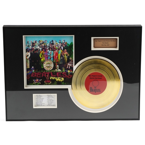 2602 - A The Beatles Sgt. Pepper's Lonely Hearts Club Band gold record display, overall 60.5cm x 40.5cm.