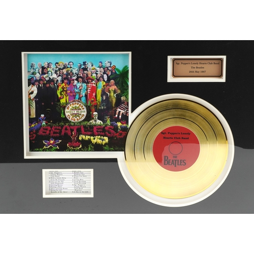 2602 - A The Beatles Sgt. Pepper's Lonely Hearts Club Band gold record display, overall 60.5cm x 40.5cm.