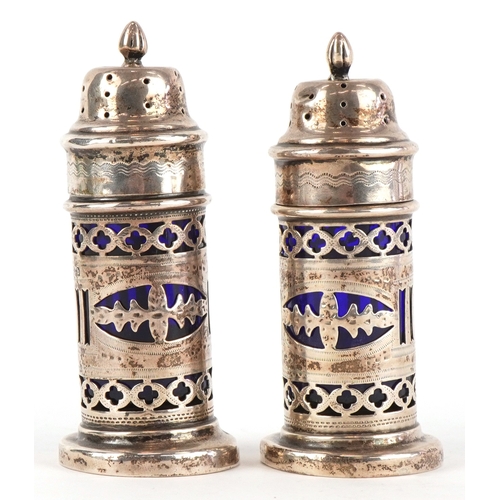 3655 - William Adams, a pair of Victorian silver casters having pierced friezes and blue glass liners, Birm... 