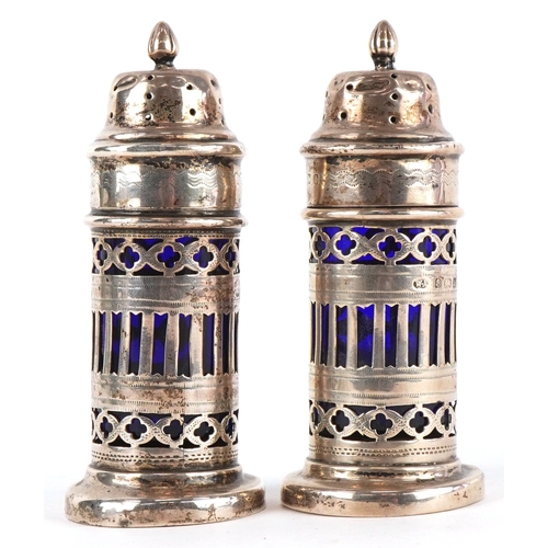 3655 - William Adams, a pair of Victorian silver casters having pierced friezes and blue glass liners, Birm... 