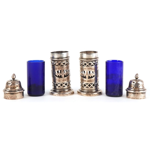 3655 - William Adams, a pair of Victorian silver casters having pierced friezes and blue glass liners, Birm... 