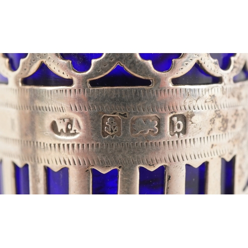 3655 - William Adams, a pair of Victorian silver casters having pierced friezes and blue glass liners, Birm... 